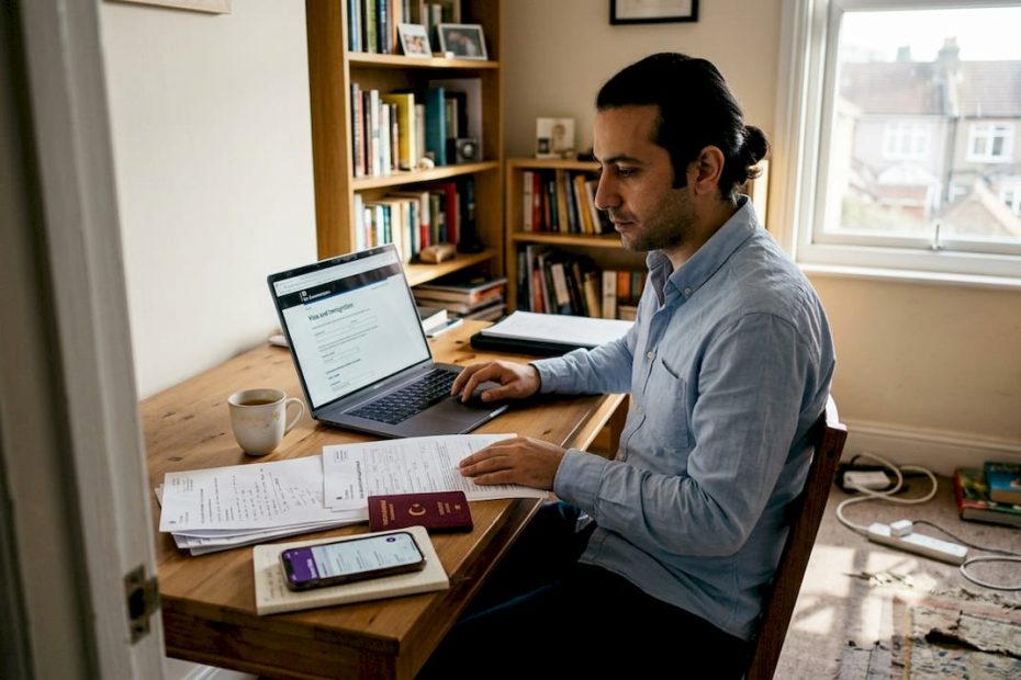 Turkish professional reviewing UK visa paperwork