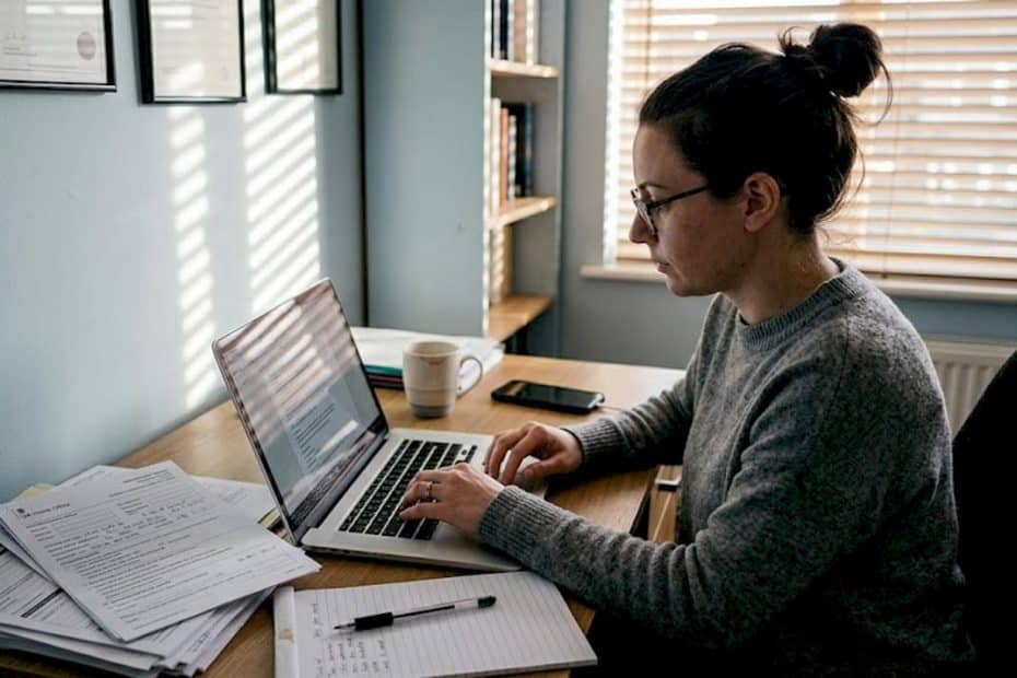 Visa adviser reviewing UK visa application at desk